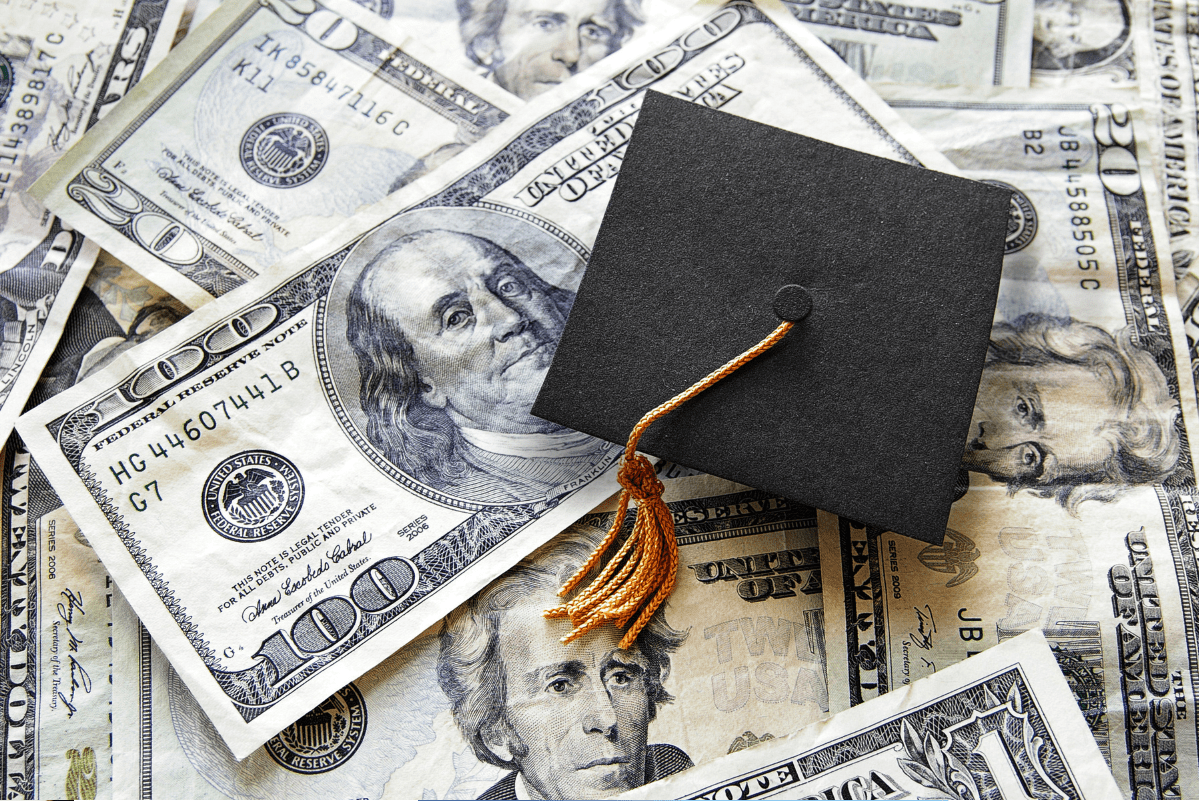 Money and a tiny graduation cap